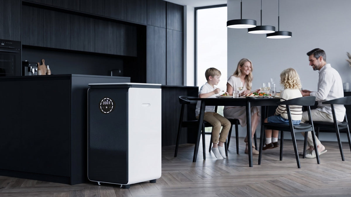 GEME Composter Pro standing on the kitchen floor with a family having dinner